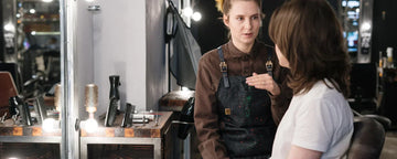 Woman getting butterfly hair cut