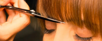 Woman getting hair cut