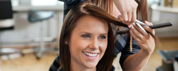 Woman getting hair cut