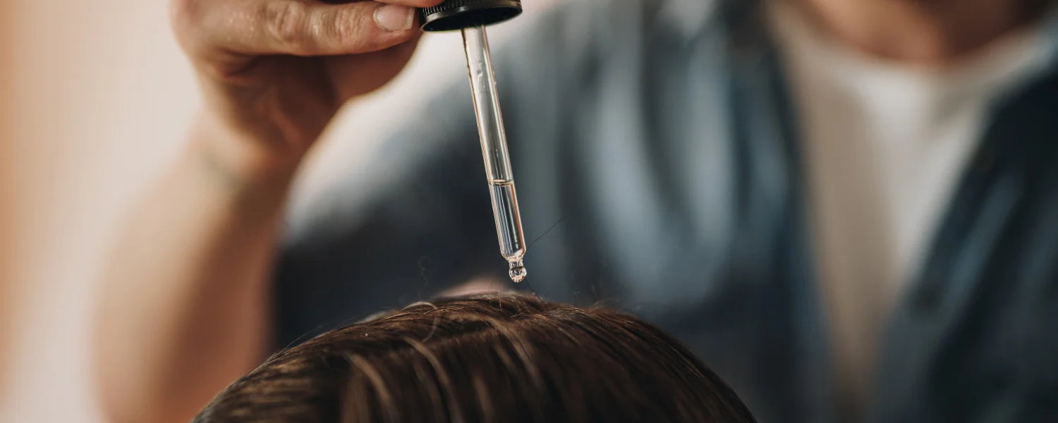 Man uses hair oil