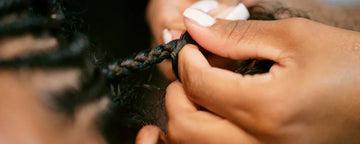 Woman getting twist braids