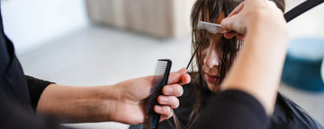 Woman getting a birkin bang haircut