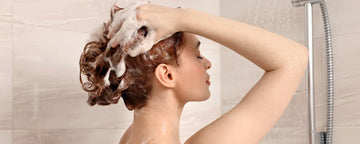 Woman using pH balanced shampoo