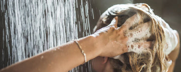 Woman using shampoo