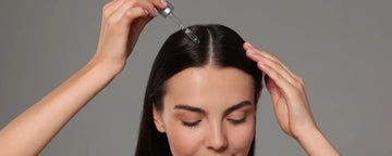 Woman using hair oil