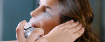 Woman using hair spray