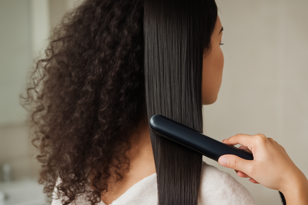 Why is my curly hair frizzy when I straighten it? Discover the reasons and solutions